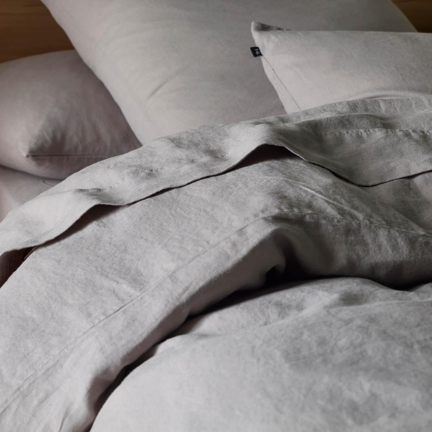The Honest Label Pure Linen European Pillowcase in Light Grey with grey tones pillowcase close up detail THL product image 2