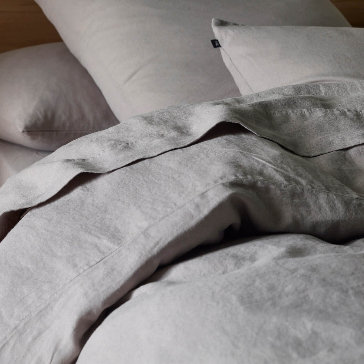The Honest Label Pure Linen European Pillowcase in Light Grey with grey tones pillowcase close up detail THL product image 2
