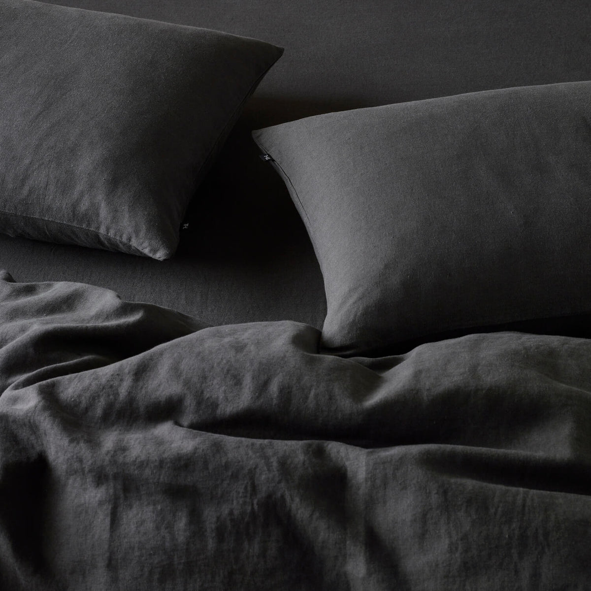 The Honest Label Pure Linen Standard Pillowcase (2 Pack) in Charcoal with grey tones pillowcase product view THL product image 3