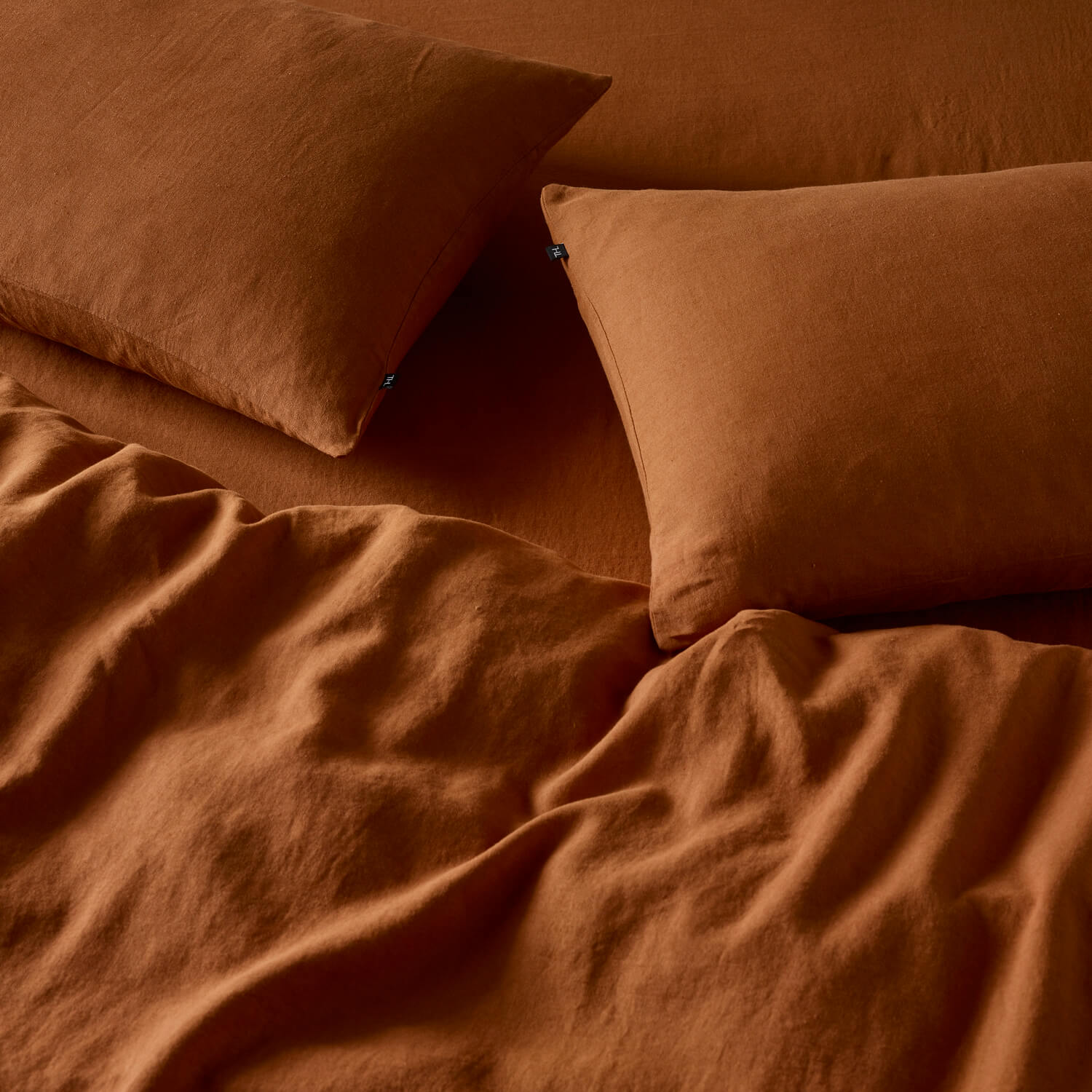 The Honest Label Pure Linen Standard Pillowcase (2 Pack) in Red Earth with red tones pillowcase product view THL product image 3