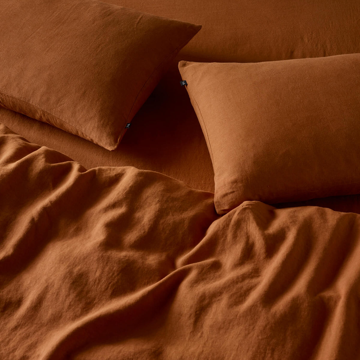 The Honest Label Pure Linen Standard Pillowcase (2 Pack) in Red Earth with red tones pillowcase product view THL product image 3