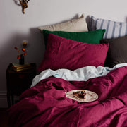 The Honest Label Pure Linen European Pillowcase in Magenta with pink tones pillowcase styled bedroom view THL product image 1