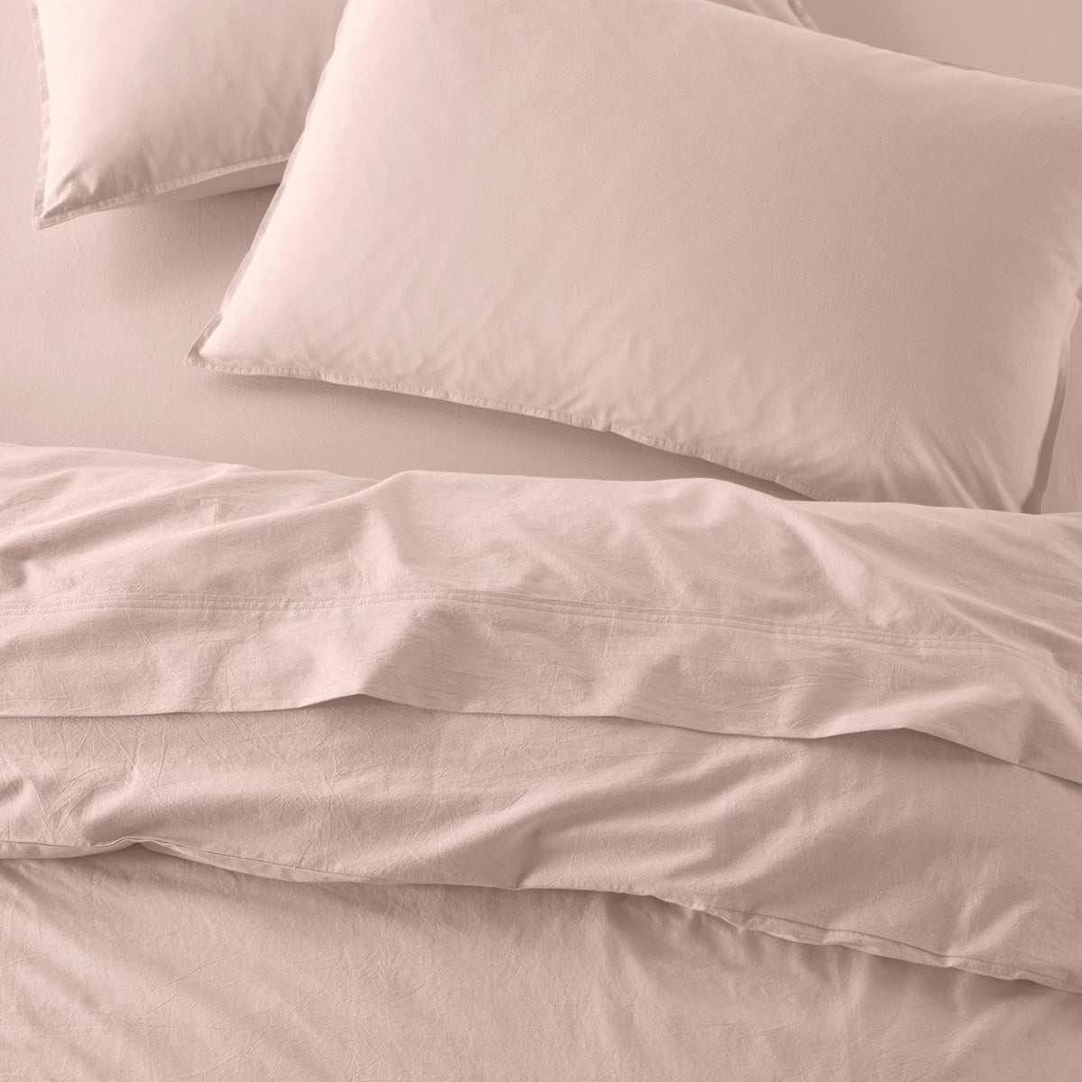 The Honest Label washed cotton bedding in Blush, overhead view