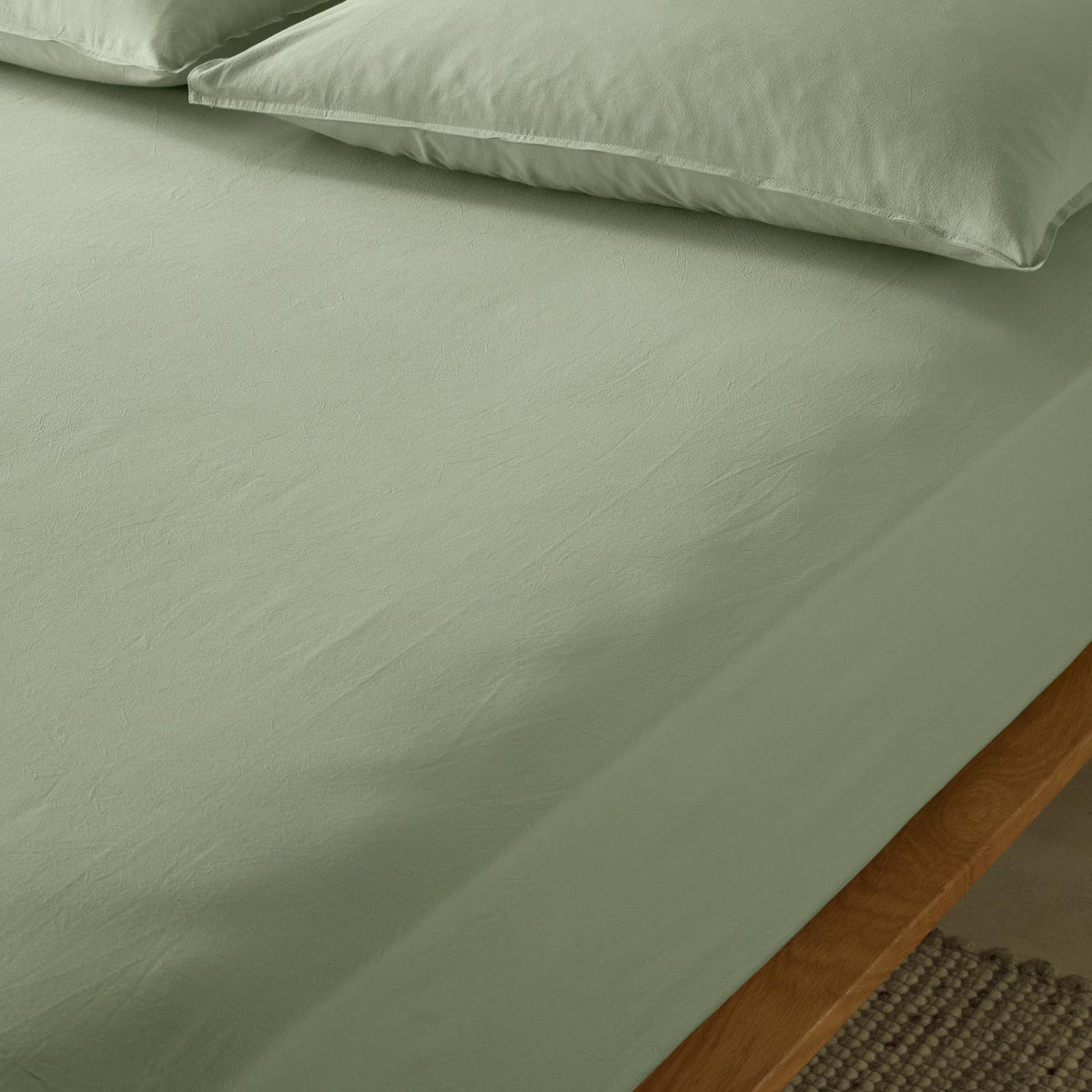 The Honest Label washed cotton bedding in Sage, detail view