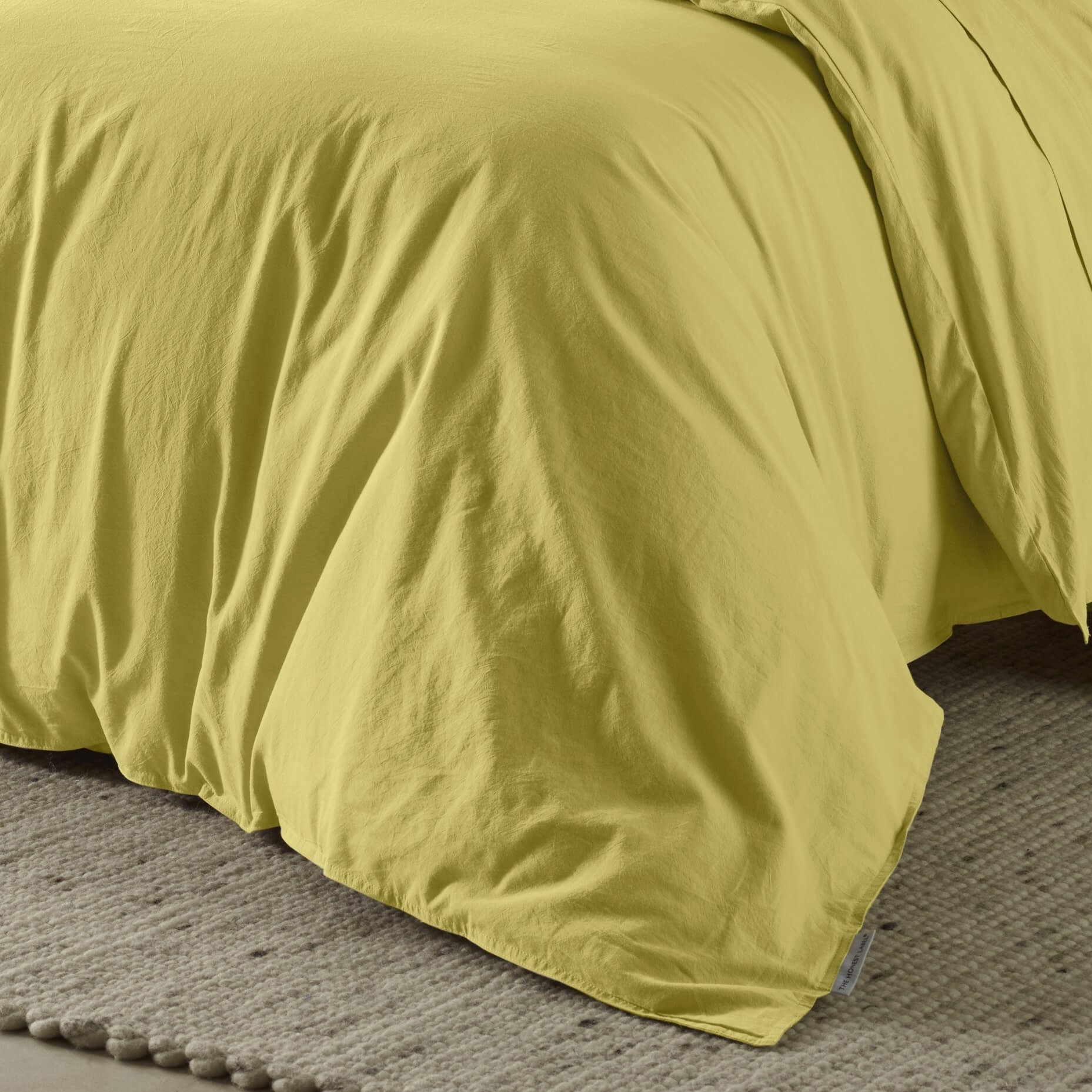 The Honest Label Washed Cotton Quilt Cover in Butter with yellow tones quilt cover close up detail THL product image 2