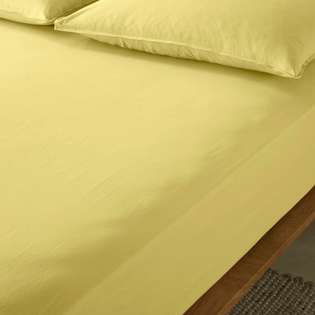 The Honest Label Washed Cotton Standard Pillowcase (2 Pack) in Butter with yellow tones pillowcase product view THL product image 3
