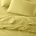 The Honest Label Washed Cotton Standard Pillowcase (2 Pack) in Butter with yellow tones pillowcase top view