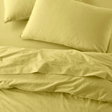 The Honest Label Washed Cotton Standard Pillowcase (2 Pack) in Butter with yellow tones pillowcase top view