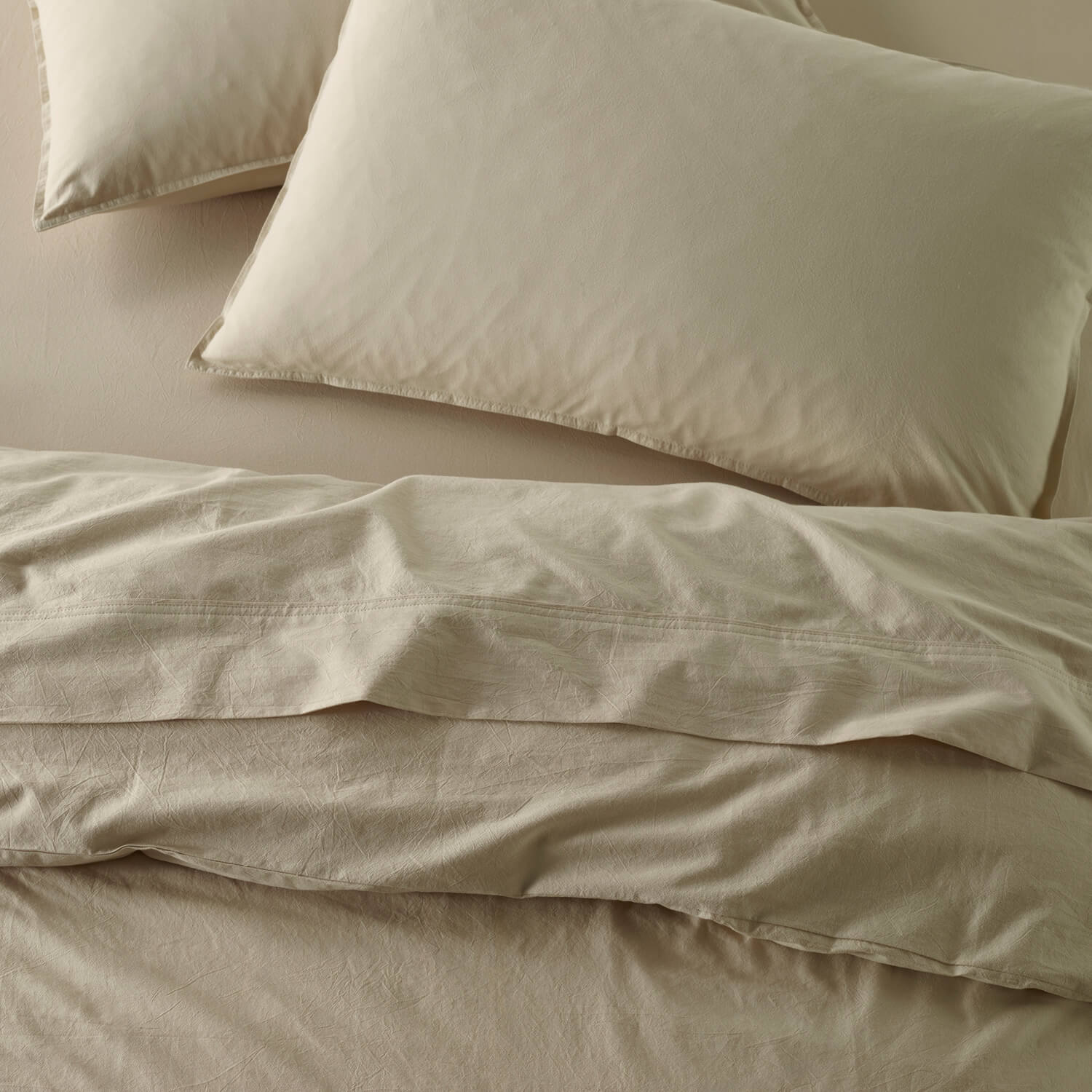 The Honest Label Washed Cotton Standard Pillowcase (2 Pack) in Flax with beige tones pillowcase top view