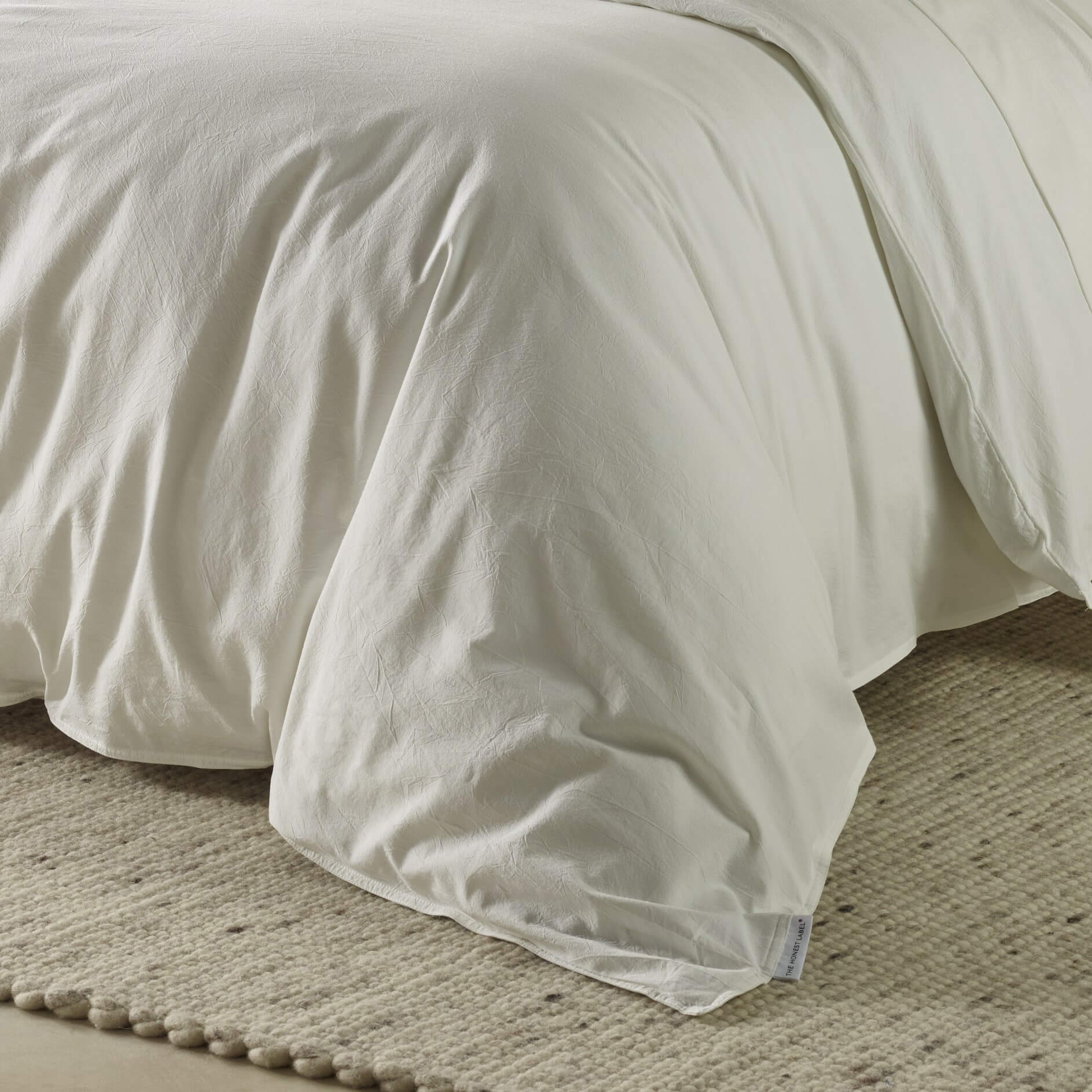 The Honest Label Washed Cotton Quilt Cover in White with white tones quilt cover close up detail THL product image 2
