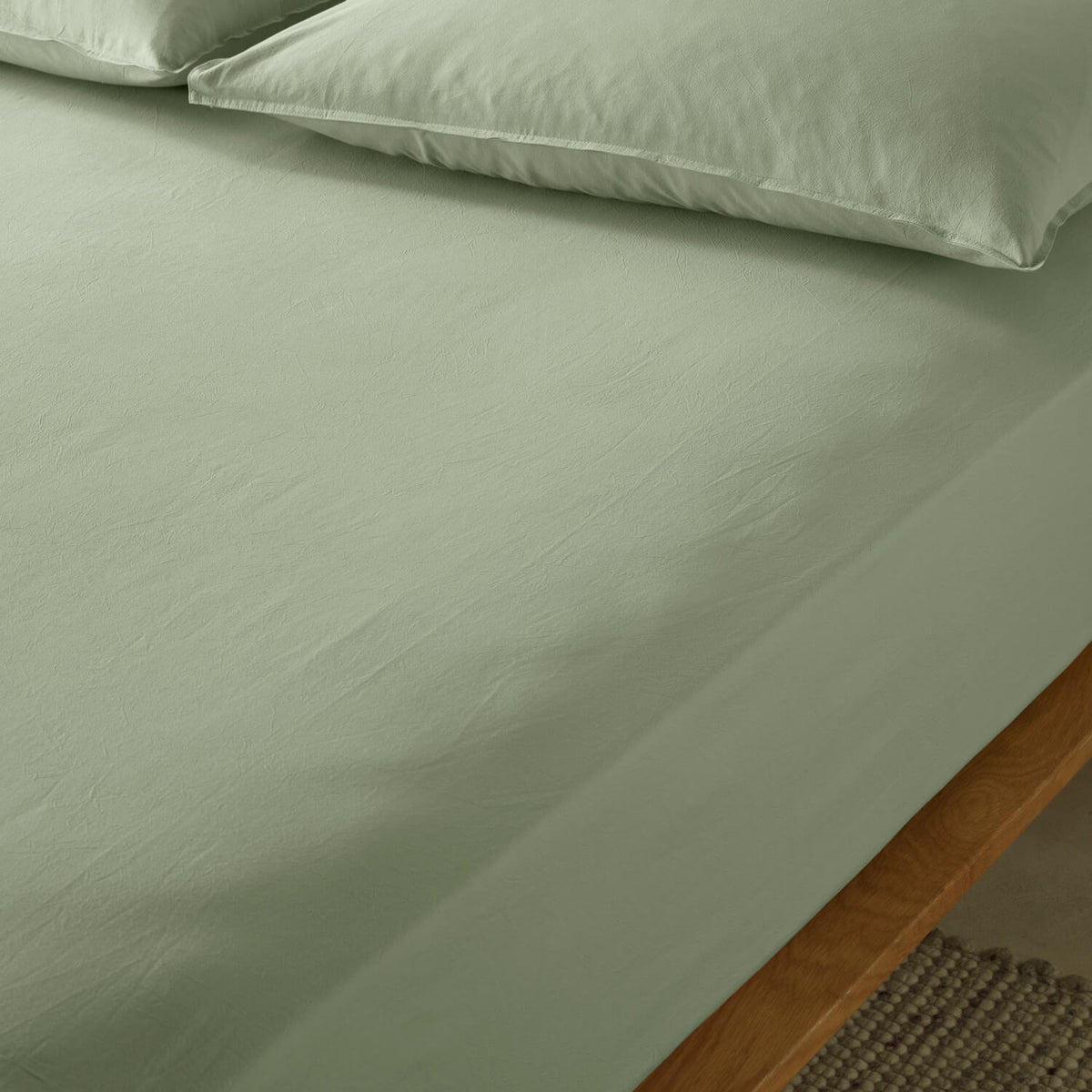 The Honest Label Washed Cotton Standard Pillowcase (2 Pack) in Sage with green tones pillowcase product view THL product image 3