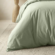 The Honest Label Washed Cotton Quilt Cover in Sage with green tones quilt cover close up detail THL product image 1