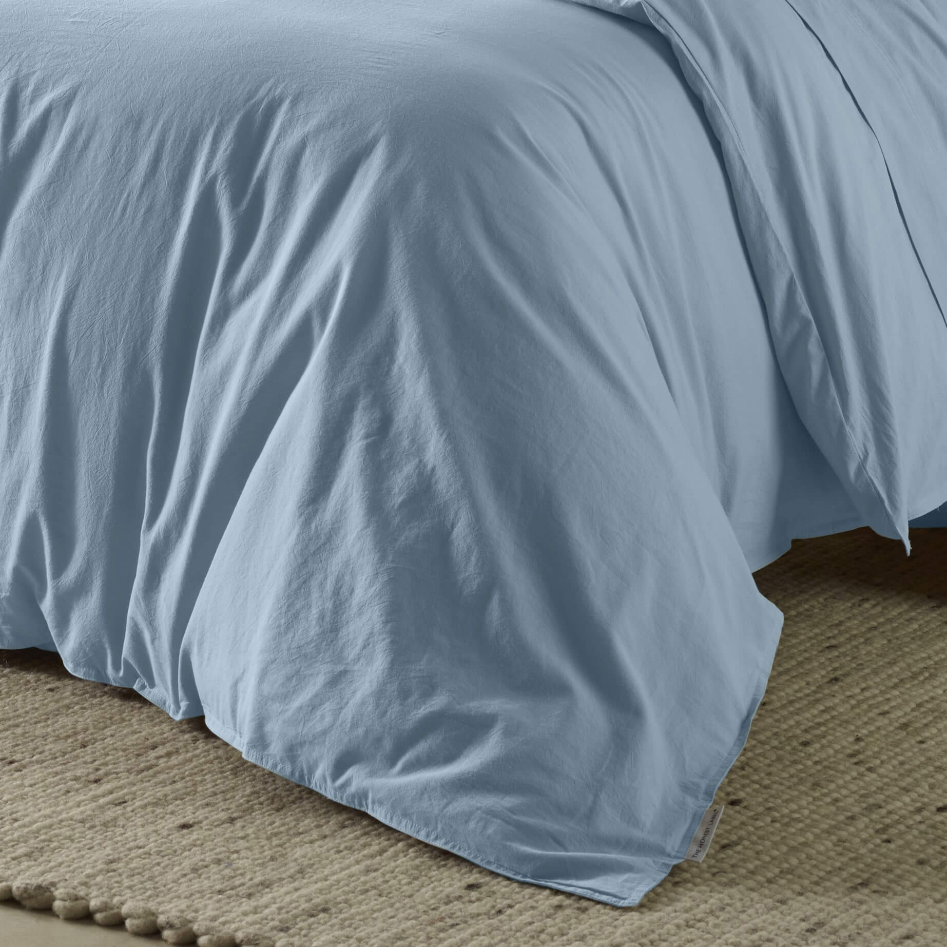 The Honest Label Washed Cotton Quilt Cover in Skye with blue tones quilt cover close up detail THL product image 2