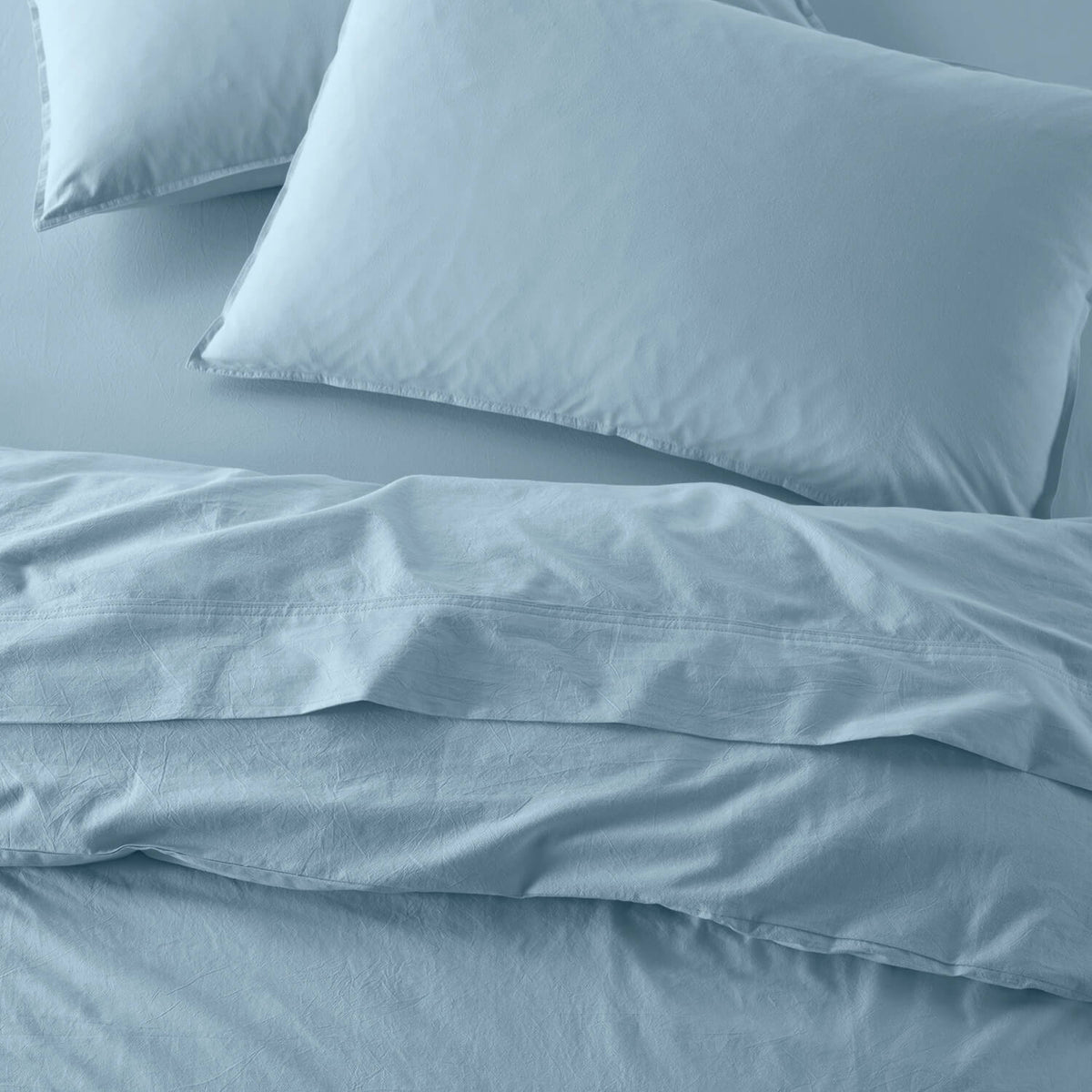 The Honest Label Washed Cotton Standard Pillowcase (2 Pack) in Skye with blue tones pillowcase top view