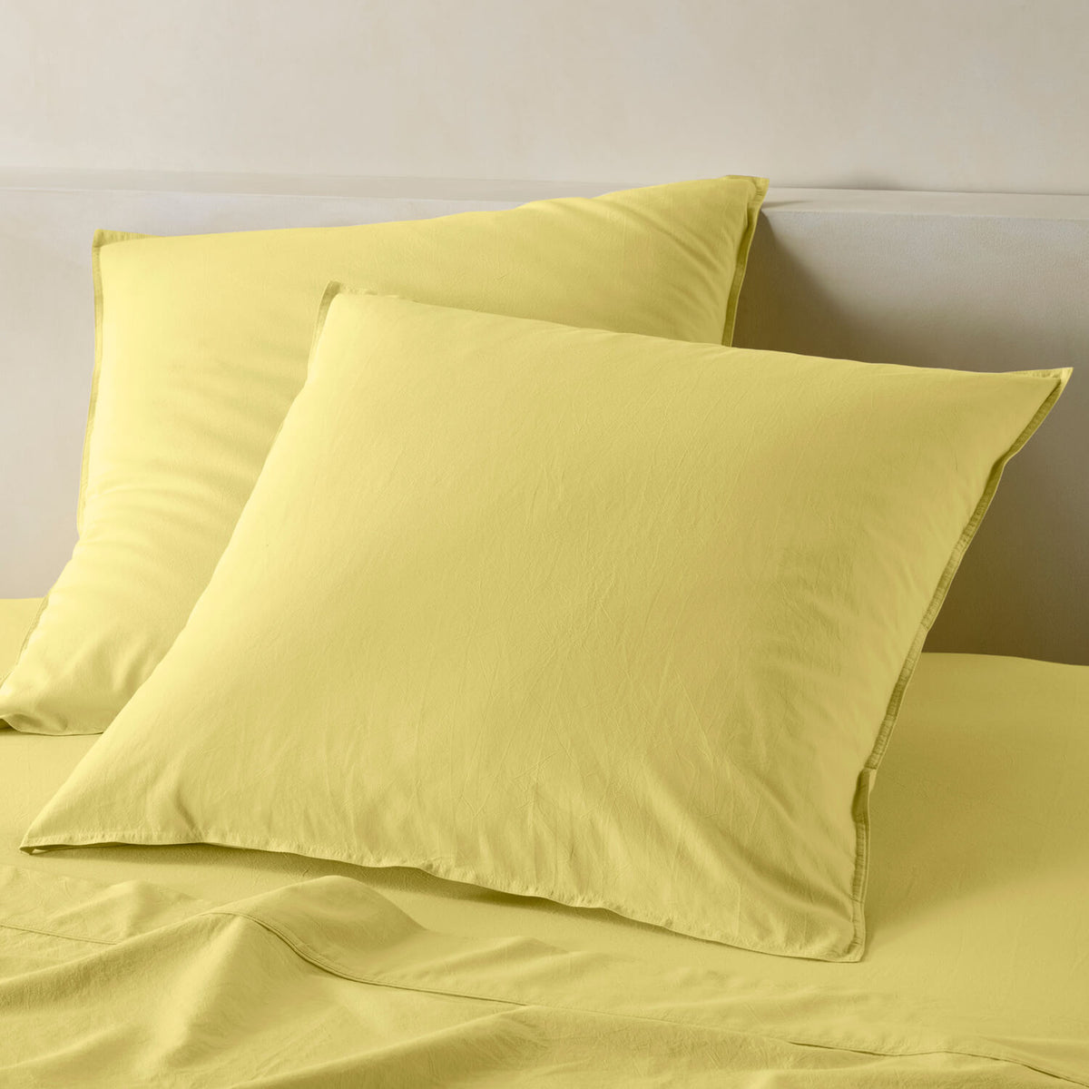 The Honest Label Washed Cotton European Pillowcase in Butter with yellow tones pillowcase product view THL product image 1