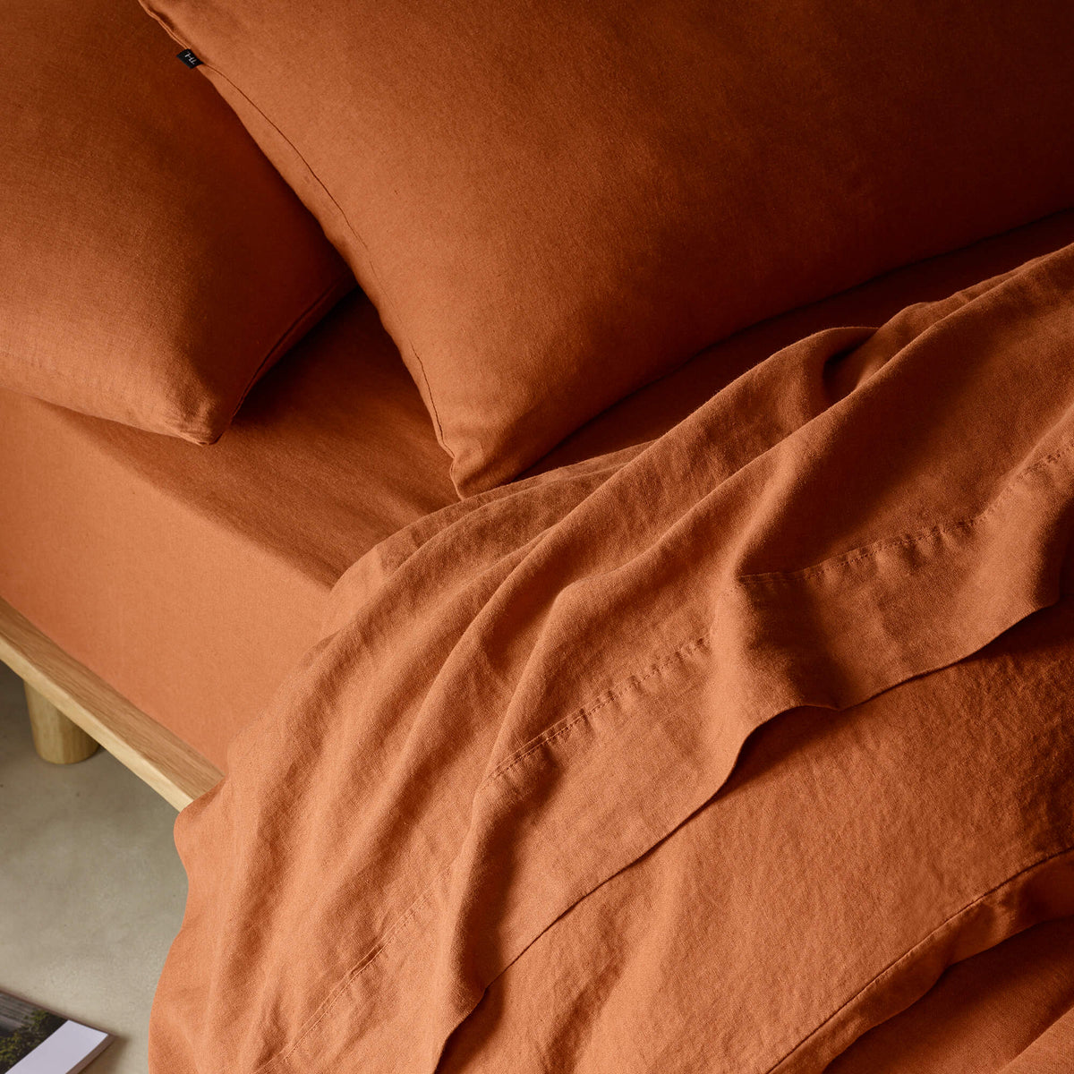The Honest Label Pure Linen Fitted Sheet in Terracotta with red tones fitted sheet product view THL product image 2
