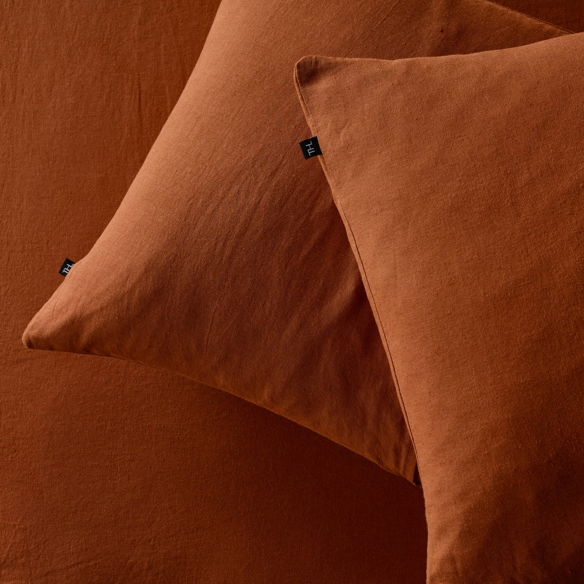 The Honest Label Pure Linen Standard Pillowcase (2 Pack) in Terracotta with red tones pillowcase product view THL product image 2