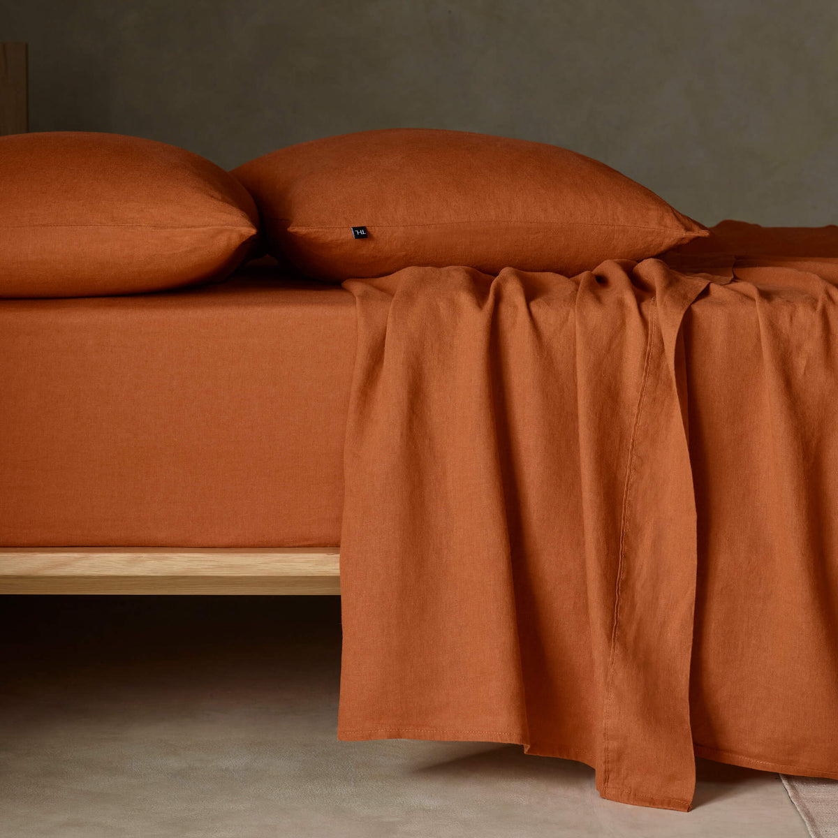 The Honest Label Pure Linen Fitted Sheet in Terracotta with red tones fitted sheet product view THL product image 1