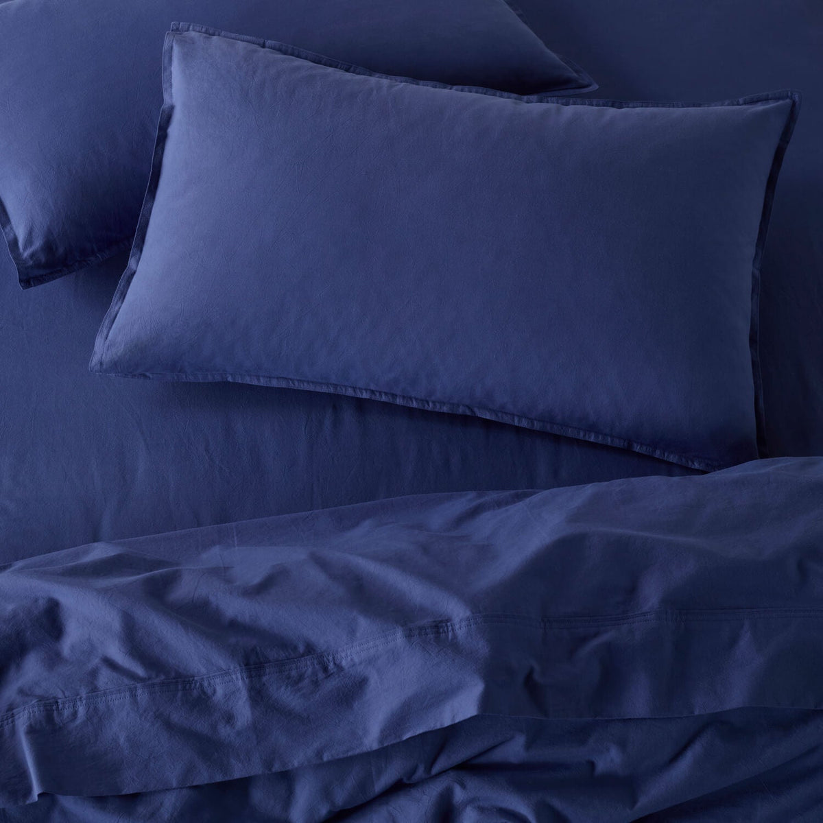 The Honest Label Washed Cotton Bedding - Cobalt with blue tones pillowcase product view THL product image 1