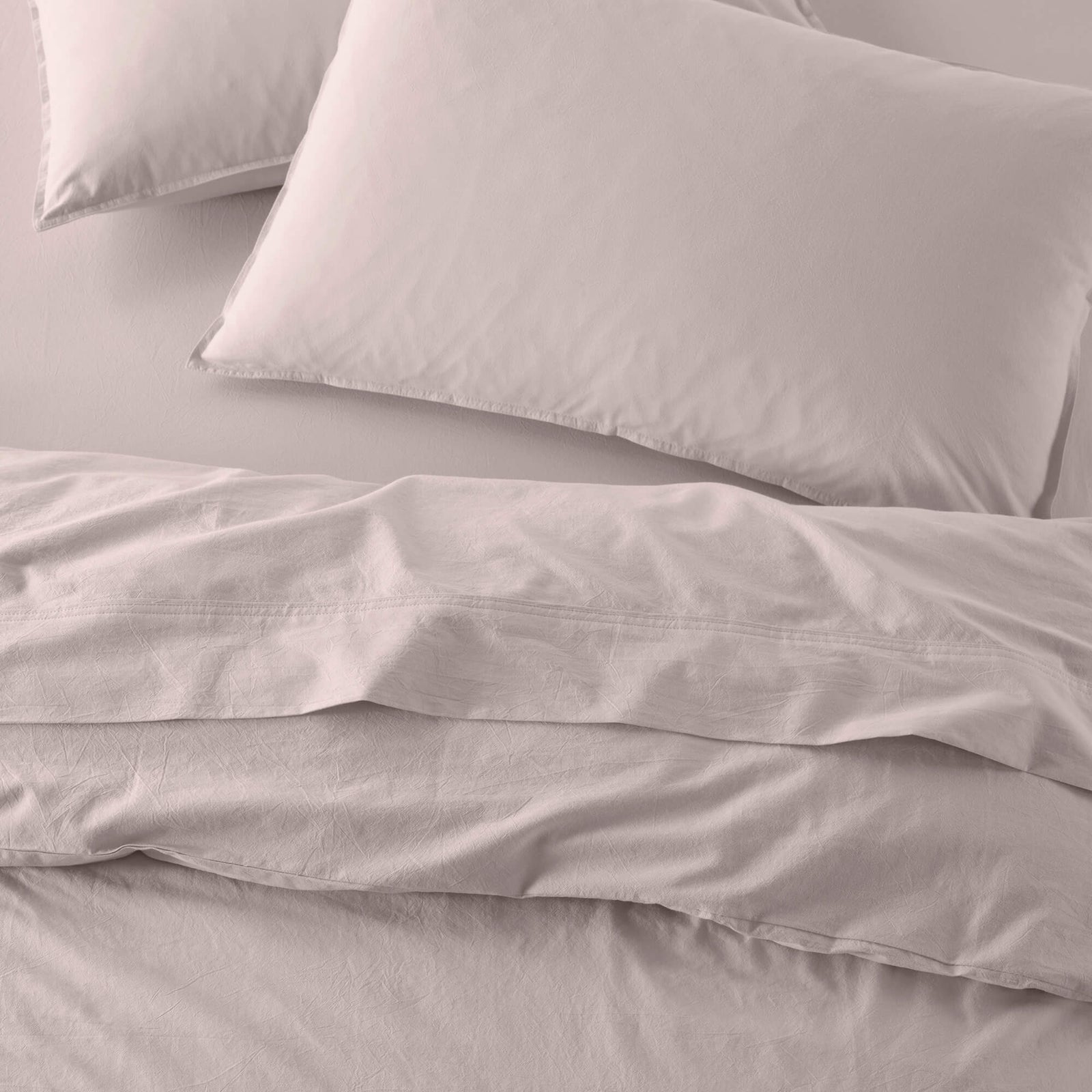 The Honest Label Washed Cotton Standard Pillowcase (2 Pack) in Blush with pink tones pillowcase product view THL product image 1