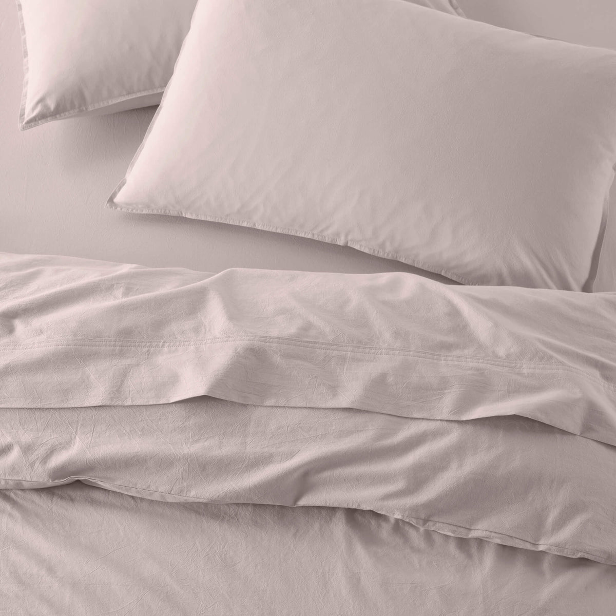 The Honest Label Washed Cotton Standard Pillowcase (2 Pack) in Blush with pink tones pillowcase product view THL product image 1