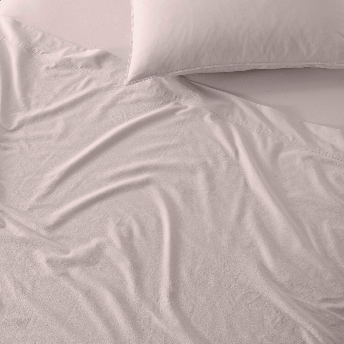 The Honest Label Washed Cotton Standard Pillowcase (2 Pack) in Blush with pink tones pillowcase product view THL product image 4