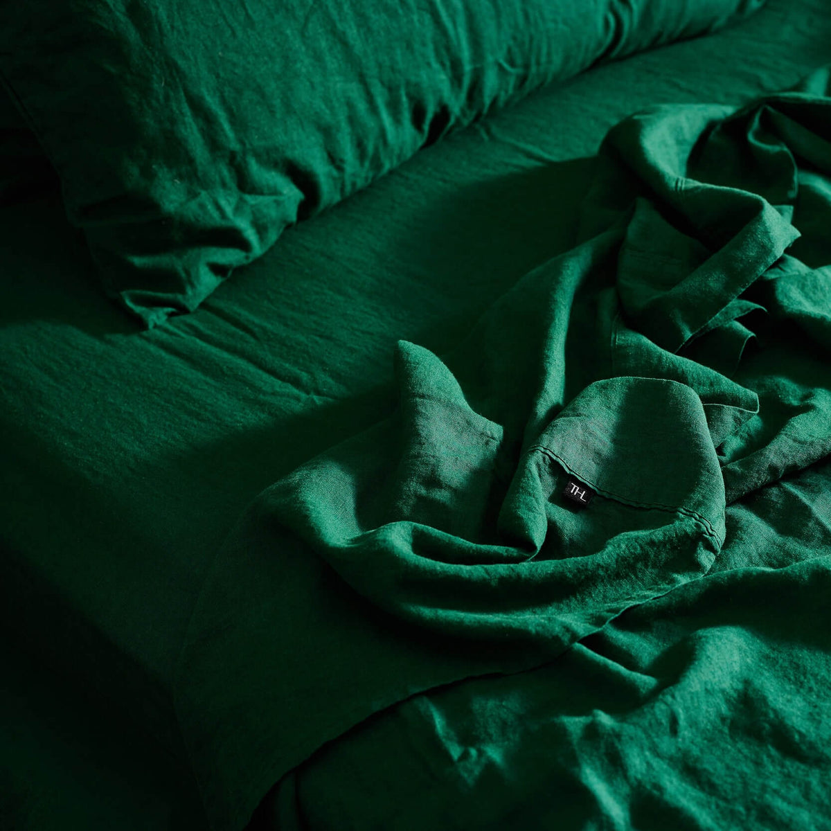The Honest Label Pure Linen Fitted Sheet in Forest Green with green tones fitted sheet product view THL product image 2