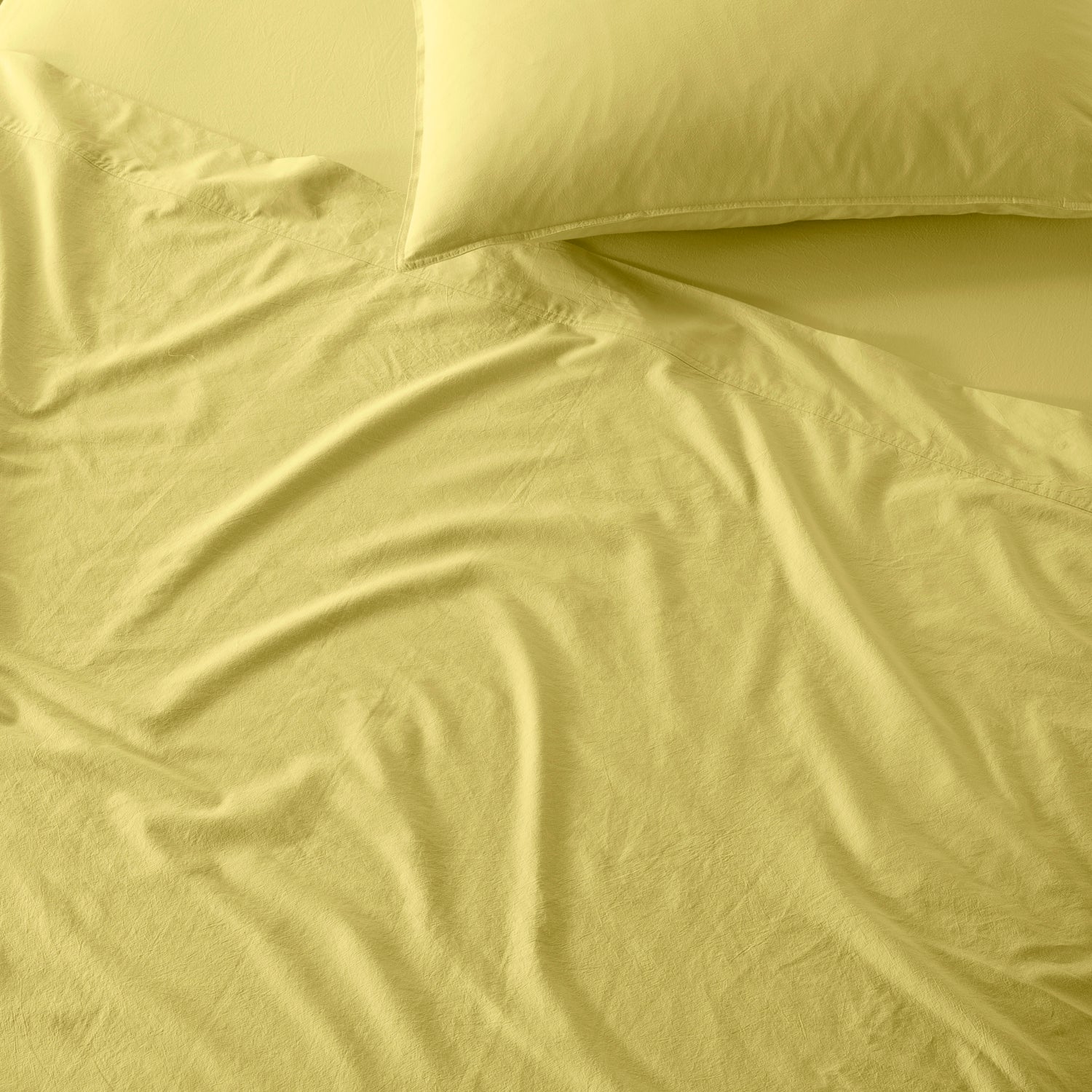 The Honest Label Washed Cotton Flat Sheet in Butter with yellow tones flat sheet product view THL product image 2