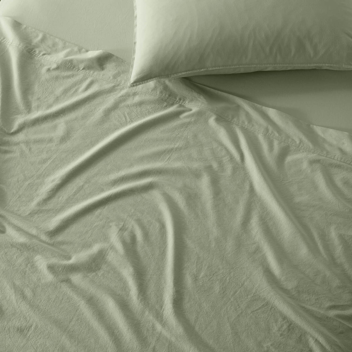 The Honest Label Washed Cotton Flat Sheet in Sage with green tones flat sheet product view THL product image 2