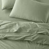 The Honest Label Washed Cotton Flat Sheet in Sage with green tones flat sheet top view
