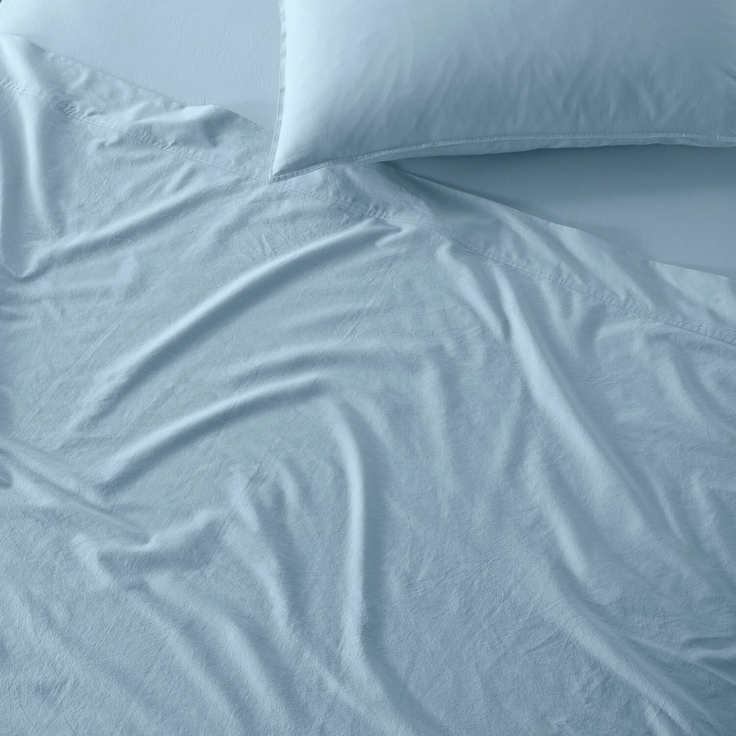 The Honest Label Washed Cotton Flat Sheet in Skye with blue tones flat sheet product view THL product image 2