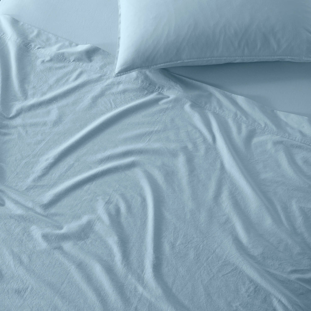 The Honest Label Washed Cotton Flat Sheet in Skye with blue tones flat sheet product view THL product image 2