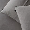 The Honest Label Pure Linen Standard Pillowcase (2 Pack) in Light Grey with grey tones pillowcase close up detail THL product image 1