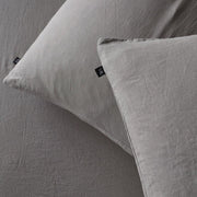 The Honest Label Pure Linen Standard Pillowcase (2 Pack) in Light Grey with grey tones pillowcase close up detail THL product image 1