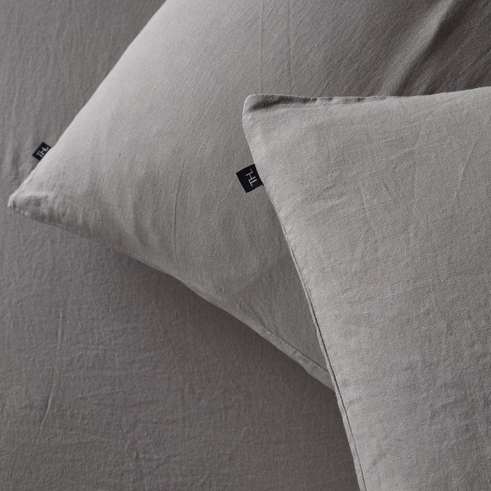 The Honest Label Pure Linen Standard Pillowcase (2 Pack) in Light Grey with grey tones pillowcase close up detail THL product image 1
